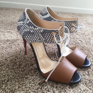 Christian Louboutin laced snakeskin pumps